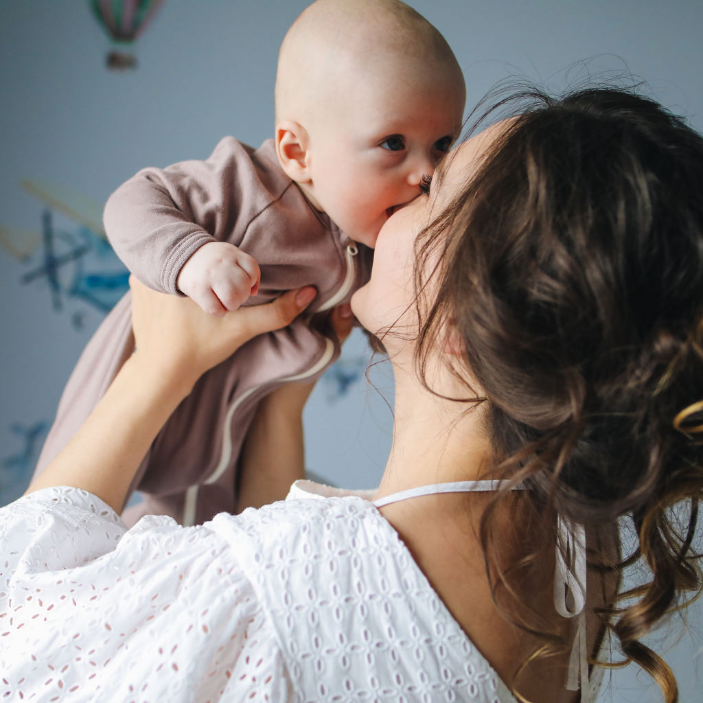 A mother sharing a joyful and loving moment of bonding